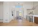 Elegant foyer featuring hardwood floors, a statement chandelier, and open sightlines at 6176 Oxford Peak Ln, Castle Rock, CO 80108