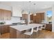 Gourmet kitchen with a large center island, stainless steel appliances, and ample counter space at 6176 Oxford Peak Ln, Castle Rock, CO 80108