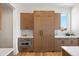 Bright kitchen featuring custom cabinetry, stainless steel appliances, and hardwood floors at 6176 Oxford Peak Ln, Castle Rock, CO 80108