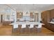 Beautiful kitchen with a large island, modern pendant lighting, and high-end appliances at 6176 Oxford Peak Ln, Castle Rock, CO 80108