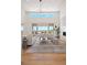 Sun-filled living room with high ceiling, natural light, and seamless access to outdoor views at 6176 Oxford Peak Ln, Castle Rock, CO 80108