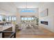 Spacious living room features vaulted ceiling, fireplace, and scenic views at 6176 Oxford Peak Ln, Castle Rock, CO 80108