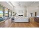 Bright living room with hardwood floors, a fireplace, and sliding doors to the patio at 6176 Oxford Peak Ln, Castle Rock, CO 80108