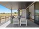 Inviting outdoor patio with comfortable seating and picturesque views of the open landscape at 6176 Oxford Peak Ln, Castle Rock, CO 80108