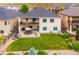 A manicured backyard with green grass, outdoor seating and patio perfect for entertaining and relaxing at 9744 W Ontario Pl, Littleton, CO 80128