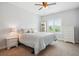 Inviting bedroom bathed in natural light, complete with a comfortable bed, dresser, and a scenic window view at 9744 W Ontario Pl, Littleton, CO 80128