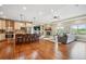 Spacious open floor plan with hardwood floors seamlessly connecting the living room and gourmet kitchen at 9744 W Ontario Pl, Littleton, CO 80128