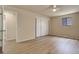 Well-lit bedroom features new flooring, neutral paint, and a sliding-door closet at 633 S Galena St, Denver, CO 80247