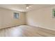 Bright bedroom boasts modern flooring, neutral walls, and window at 633 S Galena St, Denver, CO 80247