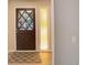 Elegant front entry door with decorative glass panels and a patterned rug at 633 S Galena St, Denver, CO 80247