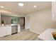 The kitchen features stainless steel appliances, a skylight, and modern countertops at 633 S Galena St, Denver, CO 80247