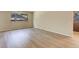 Laminate flooring runs through the living room, leading to the front door and kitchen at 633 S Galena St, Denver, CO 80247