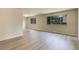 Bright living room featuring neutral walls, large windows and laminate flooring at 633 S Galena St, Denver, CO 80247