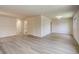 Spacious living room showcases laminate flooring, neutral paint, and abundant natural light at 633 S Galena St, Denver, CO 80247