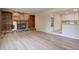 Spacious living room features a brick fireplace with bookcases and modern flooring at 633 S Galena St, Denver, CO 80247