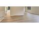 Bright open living area features modern laminate flooring, neutral paint, and an open floorplan at 633 S Galena St, Denver, CO 80247
