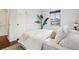 Bright bedroom featuring a large window and minimalist decor at 2459 S Corona St, Denver, CO 80210