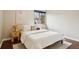 Bedroom with a white comforter, a side table and neutral wall art at 2459 S Corona St, Denver, CO 80210