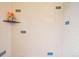 Close up of tiled shower stall, featuring bright white tiles and muted color accents at 2459 S Corona St, Denver, CO 80210