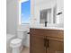 Modern bathroom featuring a toilet, vanity, and bathtub with shower at 14241 Currant St, Broomfield, CO 80020
