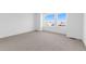Bright bedroom with large windows offering views of the outside at 14241 Currant St, Broomfield, CO 80020