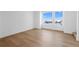 Bright bedroom with hardwood floors and large windows with neighborhood views at 14241 Currant St, Broomfield, CO 80020