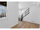 Bright entryway featuring natural light, modern staircase, and wood flooring at 14241 Currant St, Broomfield, CO 80020