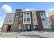 Attractive townhome with a multi-tone color scheme and a mix of horizontal and vertical lines at 14241 Currant St, Broomfield, CO 80020