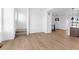Open-concept living area with hardwood floors and modern lighting at 14241 Currant St, Broomfield, CO 80020