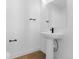 Clean powder room with floating sink, sleek fixtures, and a minimalist design at 14241 Currant St, Broomfield, CO 80020