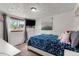 Bright bedroom with patterned bedding and natural light at 8960 Judson St, Westminster, CO 80031