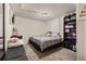 Cozy bedroom with carpet, overhead lighting, and storage shelf for organization at 8960 Judson St, Westminster, CO 80031