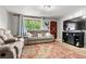 Comfortable living room with a large window and fireplace at 8960 Judson St, Westminster, CO 80031