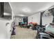 Spacious living room with carpet flooring, television and access to dining area at 8960 Judson St, Westminster, CO 80031