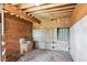 Barn interior with wooden sink, wood paneling, concrete base, and overhead lighting at 7390 Rafter Rd, Franktown, CO 80116