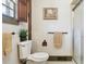 Bathroom showing toilet, towel rack and shower with clear glass doors at 7390 Rafter Rd, Franktown, CO 80116