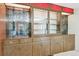 Built-in wooden hutch featuring glass doors, decorative trim, and ample storage space at 7390 Rafter Rd, Franktown, CO 80116