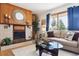 Comfortable living room with a fireplace, mantle, and large window with views at 7390 Rafter Rd, Franktown, CO 80116