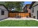 Cozy backyard featuring a patio area, chair and table set, and an air conditioning unit at 2569 Forest St, Denver, CO 80207