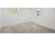 Neutral basement bedroom with carpet flooring, and two window wells at 2569 Forest St, Denver, CO 80207