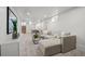 Spacious finished basement with living area, dining space, comfortable seating, and plenty of natural light at 2569 Forest St, Denver, CO 80207
