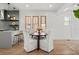 Dining area with hardwood floors adjacent to the kitchen, and lots of natural light at 2569 Forest St, Denver, CO 80207