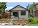 Charming home featuring new landscaping and a cozy front porch at 2569 Forest St, Denver, CO 80207