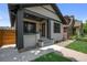 Exterior angle shot showcasing the charming facade, landscaping, and welcoming entrance at 2569 Forest St, Denver, CO 80207