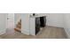 Convenient laundry area with modern washer and dryer units, stylish tile floors, and easy access to stairs at 2569 Forest St, Denver, CO 80207