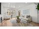 Bright living room with hardwood floors, fireplace, and large windows at 2569 Forest St, Denver, CO 80207