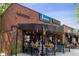 Kearney Street restaurant featuring outdoor seating with decorative hanging lights and flower baskets at 2569 Forest St, Denver, CO 80207