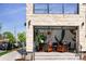 Modern restaurant with a stone facade, large windows, and a minimalist interior design at 2569 Forest St, Denver, CO 80207