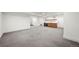 Spacious finished basement featuring plush carpet, neutral paint, and a stylish bar area for relaxing at 1490 S Vine St, Denver, CO 80210