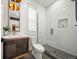 Modern bathroom featuring a glass enclosed shower, unique tile flooring, and a stylish vanity at 1490 S Vine St, Denver, CO 80210
